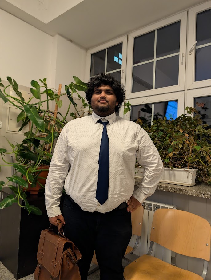 Portrait of Puneeth Bheesetty in formal attire